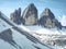 Spring trek around the Tre Cime above snowy landscape. Sunny April evening, view from tour around at sunset, Dolomite Alps Italy