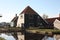 Spring trip to Zaanse Schans. Placid channels, tranquil rivers flow between the hills. The Dutch windmills stand as a traditional