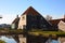 Spring trip to Zaanse Schans. Placid channels, tranquil rivers flow between the hills. The Dutch windmills stand as a traditional