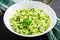 Spring vegan salad with cabbage, cucumber, green onion and parsley