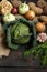 Spring vegetables on a dark background: Savoy cabbage, cauliflower, onion, garlic, kohlrabi, celery root, dill