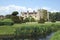 Spring view of a garden at a riverside. Hever castle, England