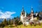 Spring view of Peles Castle with snow Bucegi