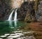 Spring water flowing down in waterfall in deep canyon. Impressive autumn scene of Plitvice National Park, Croatia, Europe. Abandon