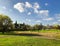 Spring weather, sunny sky, flowering trees in the village.