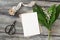 Spring wedding stationery. Blank greeting card, invitation mockup. Black vintage scissors, silk ribbon and bouquet of