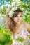 Spring Woman.Beautiful Girl model with spring flowers. Young Fem