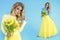 Spring Woman. Beauty Summer model girl with colorful clothes, holding a bouquet of spring flowers. Beautiful lady with yellow