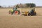 Spring work at farm. Farmer in tractor preparing the field for sowing. Farmer land and traktor