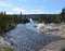 Spring in Yellowstone: Mortar Geyser and Fan Geyser of the Morning Glory Group on the Bank of Firehole River in Upper Geyser Basin