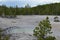 Spring in Yellowstone: Small Unnamed Pool in the Back Basin Area of Norris Geyser Basin with Gallatin Range in the Background