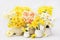 Springtime blooming yellow, white and apricot color daffodils, spring blossoming narcissus jonquil flowers bouquet background