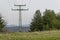 Springtime forest with glade, residential district and old electric power transmission line, Plana mountain