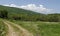 Springtime green forest, glade and valley among Lozen mountain, Plana mountain and snowy Vitosha mountain near to Pasarel village