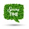 Springtime greeting in a speech bubble of green leaves