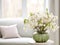 Springtime home decor in white color, spring interior decorations with early flowers, cozy sofa and big windows