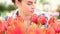 Springtime, smiling woman in garden with tulips