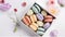 Springtime Sweets, Colorful Macaroons in a Beautifully Presented Box on white background. AI Generative