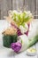 Springtime table decoration with tulips and lit candle