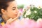 Springtime, woman in garden of daisies flowers