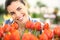 Springtime, woman in garden with flowers tulips