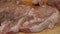 Sprinkle pork steaks with spices on a Board. pork tenderloin
