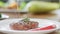 Sprinkle salt on appetizing beef piece serving on plate slow motion. Close up shot on 4k RED camera