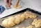 Sprinkle with sesame seeds buns. Easter pastries, challah, rabbit-shaped buns. Proofing baking before placing in the oven. Close-