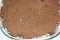 sprinkled cocoa powder texture on cake, top view of home made tiramisu dessert
