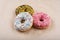 Sprinkled confetti with baked donuts with different icing