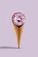 Sprinkled and glazed donut in sweet wafer cone on lilac background. Food, treats and unhealthy nutrition. Close up, copy