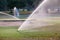 Sprinkler watering in golf course