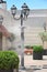 Sprinklers splashing vaporized water at street in order to cool the hot summer temperature