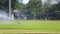 Sprinklers spraying water on grass in football field