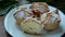 Sprinkling soffioni abruzzesi with powdered sugar. Dusting ricotta pastries with the icing sugar