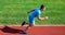 Sprinter athlete run training. Athlete run track grass background. Sprinter training at stadium track. Progress and