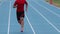 Sprinter runner athlete man sprinting training on athletics track and field