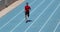 Sprinter runner athlete man sprinting training on athletics track and field