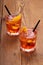 Spritz aperitif, two orange cocktail with ice cubes