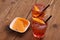 Spritz aperitif - two orange cocktail, ice cubes, potato chips