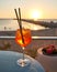 Spritz traditional cocktail with alcohol at a beach bar. European summer drink. Italian drink. Lifestyle concept