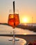 Spritz traditional cocktail with alcohol at a beach bar. European summer drink. Italian drink. Lifestyle concept