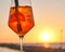 Spritz traditional cocktail with alcohol at a beach bar. European summer drink. Italian drink. Lifestyle concept