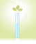 Sprout in a test tube on a green background