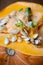 Sprouting pumpkin seeds and fibrous strands within cut pumpkin. Close-up