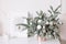Spruce branches with ornaments. Vase with fir branches bouquet. Christmas decoration. Winter, New Year, Christmas concept.