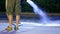 Spurting the water on the concrete surface at night