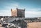 Sqala du Port, a defensive tower at the fishing port of Essaouira, Morocco near Marrakech. Blue sky with clouds and