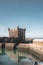 Sqala du Port, a defensive tower at the fishing port of Essaouira, Morocco near Marrakech. Blue sky with clouds and