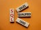 SQL - Sales Qualified Lead. Wooden cubes with words SQL. Beautiful orange background. Business and SQL concept. Copy space